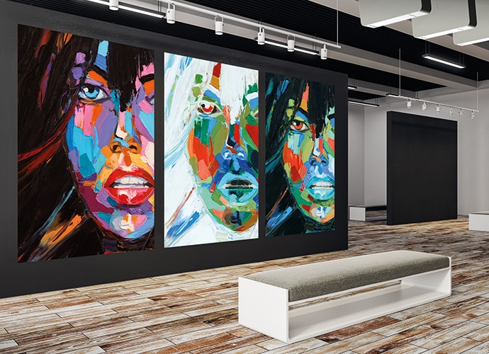 Exhibition of large three close up images of a womans face