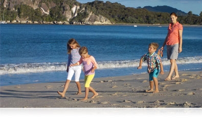 Photo of a family walking on the beach, showing sharp photos of moving subjects