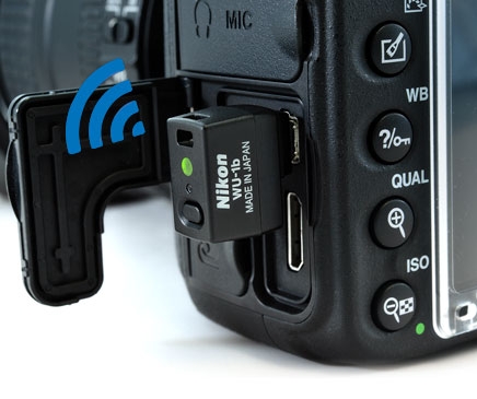 Close up product shot of the WU-1b wireless mobile adapter attached to the Nikon D610
