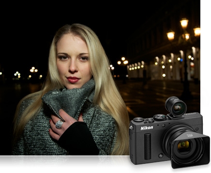 photo of a blonde woman in a sweater taken at night outdoors with a product shot of the Nikon COOLPIX A inset